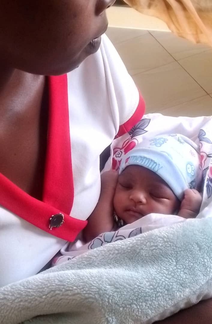 Young mother and her newborn daughter at Nsawo RCC Medical Centre